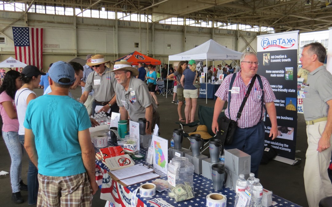 volunteers answer questions about Georgia FairTax at local event